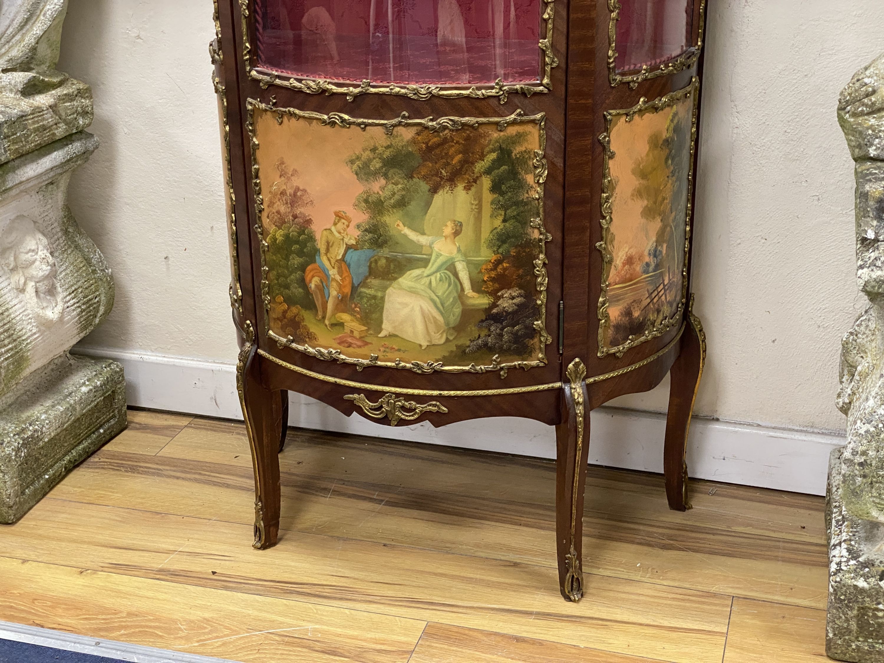 A reproduction gilt metal mounted Vernis Martin style bow front vitrine, width 68cm, depth 36cm, height 166cm